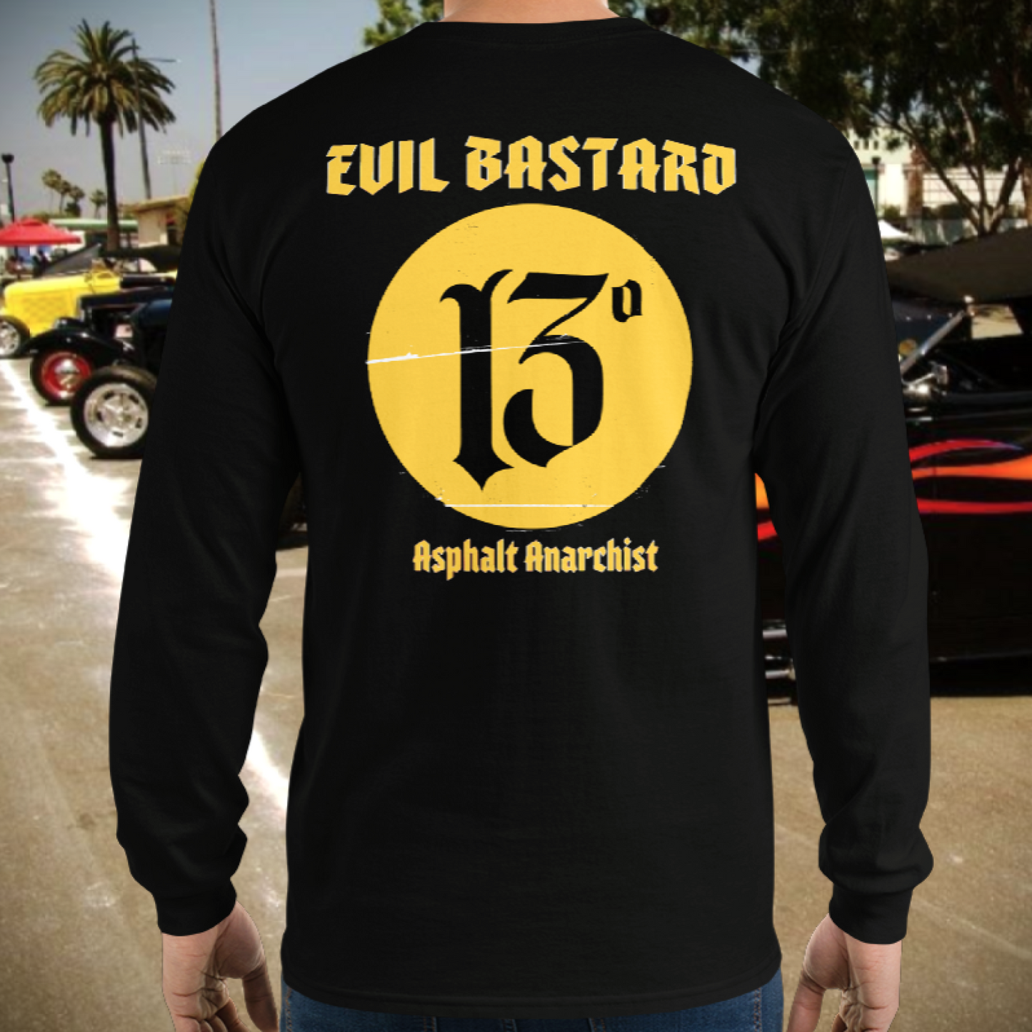 A gearhead attends a vintage Hot Rod show. He is wearing the Evil Bastard Long Sleeve Shirt from Asphalt Anarchist Clothing Co. KUSTOM KULTURE APPAREL & PRODUCTS