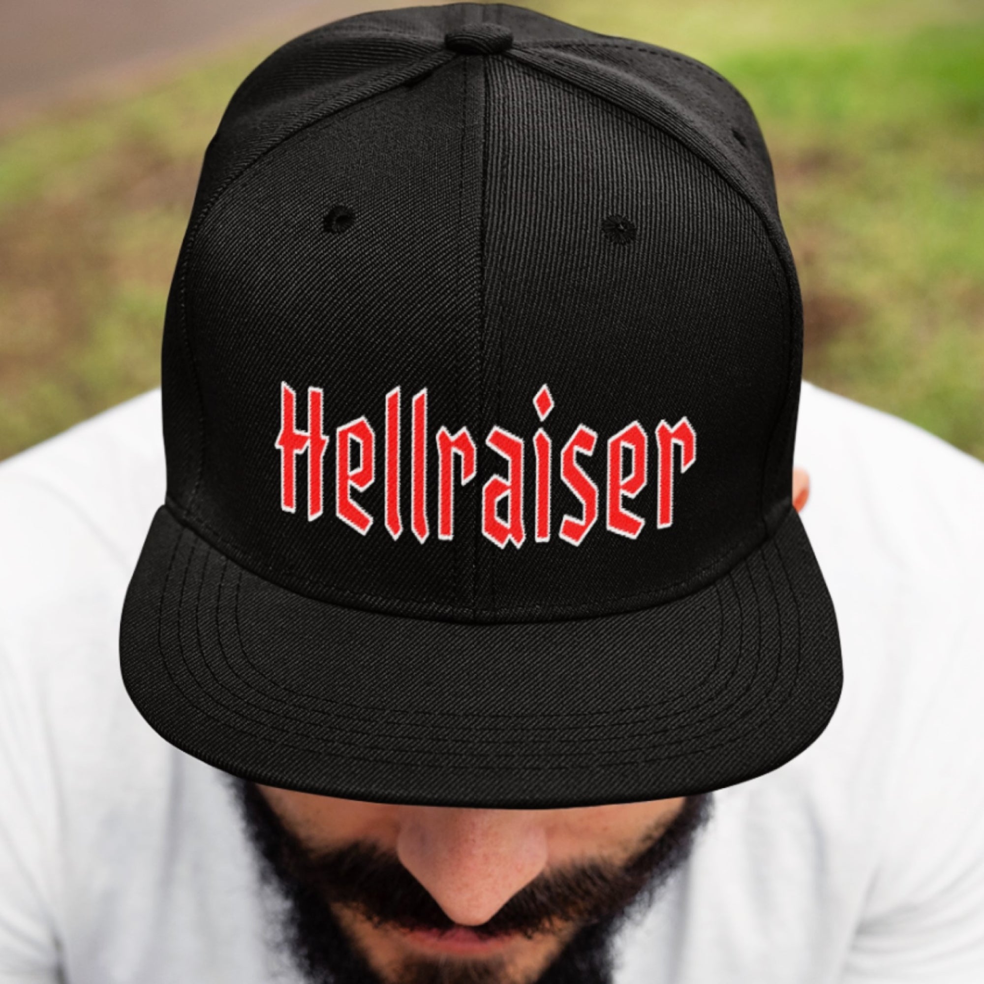 A gearhead dude is wearing the Hellraiser Hat from Asphalt Anarchist Clothing Co. KUSTOM KULTURE APPAREL & PRODUCTS - Fuck the Status Quo